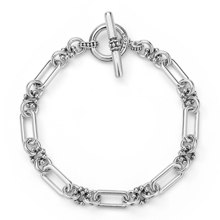Signature Caviar Petite Sterling Silver Link Bracelet: Close-up of delicate sterling silver links with bead clusters and toggle clasp, showcasing refined elegance for versatile wear.