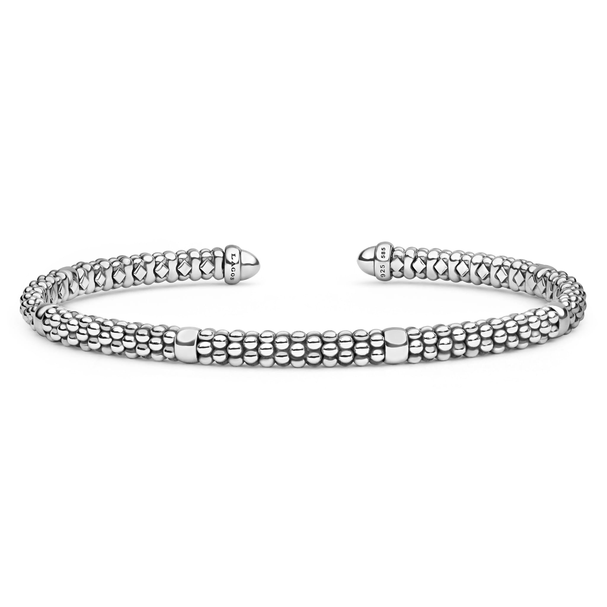 Signature Caviar Two-Tone Mini Versa Torque Bracelet: 3mm sterling silver open-ended bangle with parallel caviar bead strands, 14K gold accents, and LAGOS hallmark tips.