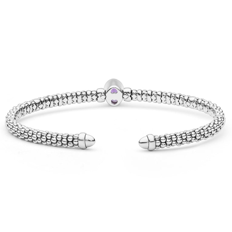  3mm features sterling silver caviar beading, an oval amethyst center, and 14K gold accents.