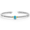 Signature Caviar Two-Tone Swiss Blue Topaz Oval Mini Versa Torque Bracelet features a sterling silver cuff with caviar beading, a central blue topaz, and 14K gold accents.