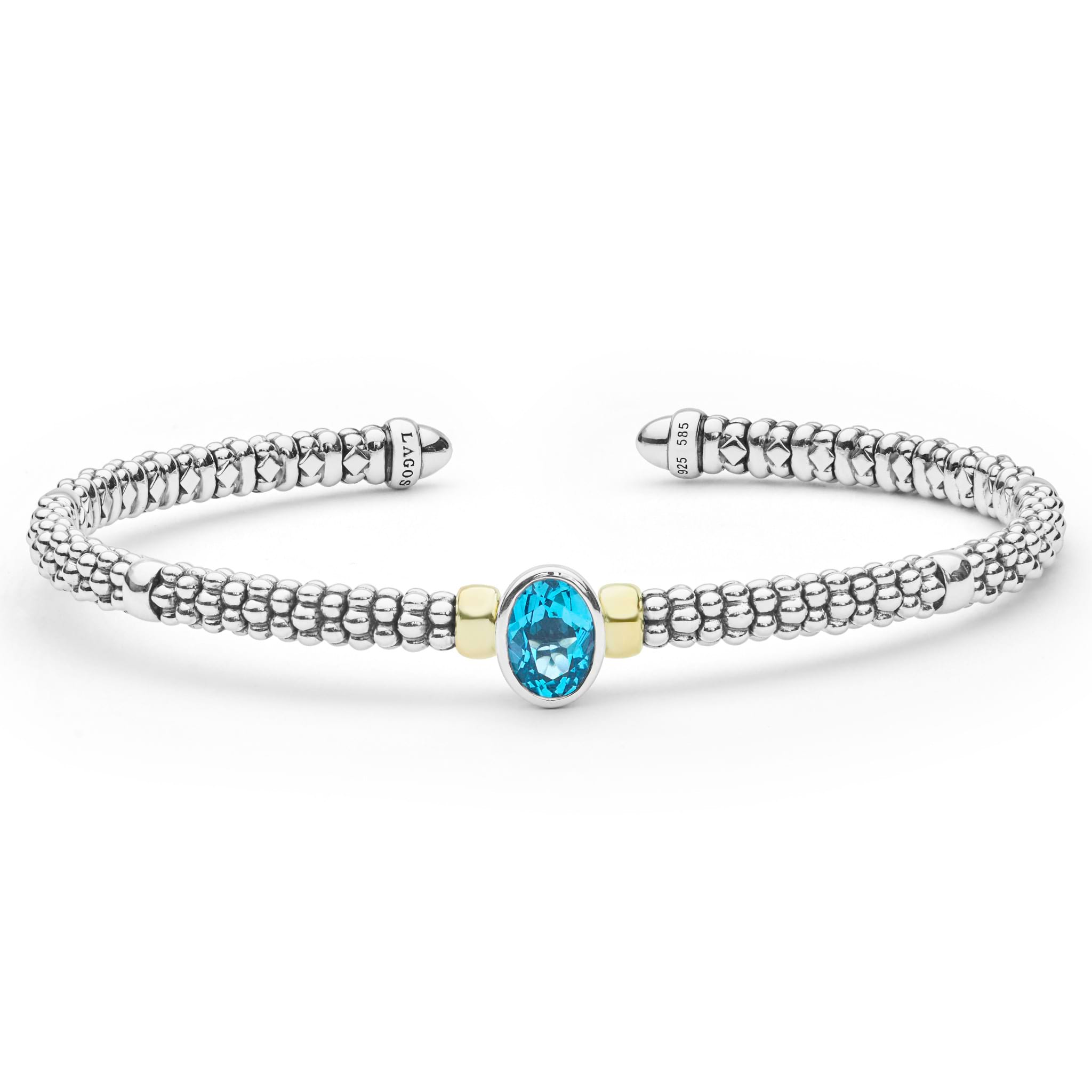  3mm features sterling silver caviar beading, 18K gold accents, and a faceted blue topaz centerpiece.