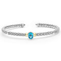  3mm features sterling silver caviar beading, 18K gold accents, and a faceted blue topaz centerpiece.