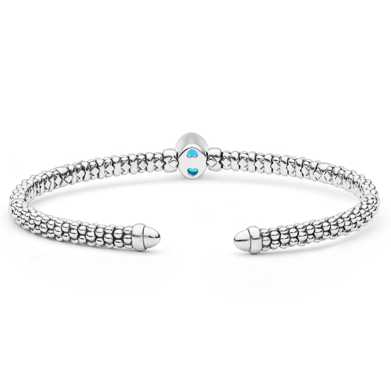  3mm, featuring sterling silver caviar beading, 14K gold accents, and a central blue topaz gemstone.