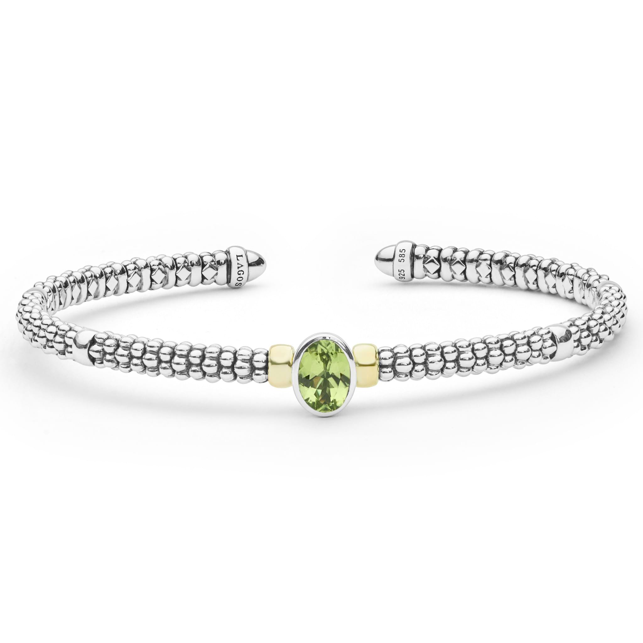 Signature Caviar Two-Tone Peridot Oval Mini Versa Torque Bracelet 3mm with sterling silver caviar beading, 14K gold accents, and central oval peridot gemstone.