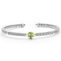 Signature Caviar Two-Tone Peridot Oval Mini Versa Torque Bracelet 3mm with sterling silver caviar beading, 14K gold accents, and central oval peridot gemstone.