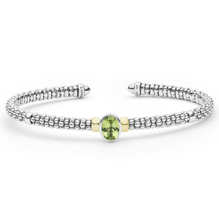 Signature Caviar Two-Tone Peridot Oval Mini Versa Torque Bracelet 3mm with sterling silver caviar beading, 14K gold accents, and central oval peridot gemstone.