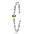 Signature Caviar Two-Tone Peridot Oval Mini Versa Torque Bracelet with sterling silver and 14K gold accents, featuring a central peridot gemstone and caviar beading.