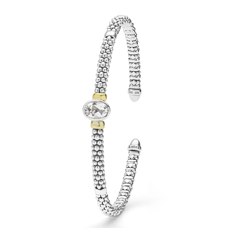 Signature Caviar Two-Tone White Topaz Oval Mini Versa Torque Bracelet in sterling silver with 14K gold accents, featuring caviar beading and a radiant white topaz gemstone.
