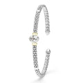 Signature Caviar Two-Tone White Topaz Oval Mini Versa Torque Bracelet features sterling silver caviar beading, 14K gold accents, and a central faceted white topaz gemstone.