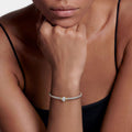  3mm shown on wrist, showcasing sterling silver caviar beading and 14K gold accents with a central white topaz.