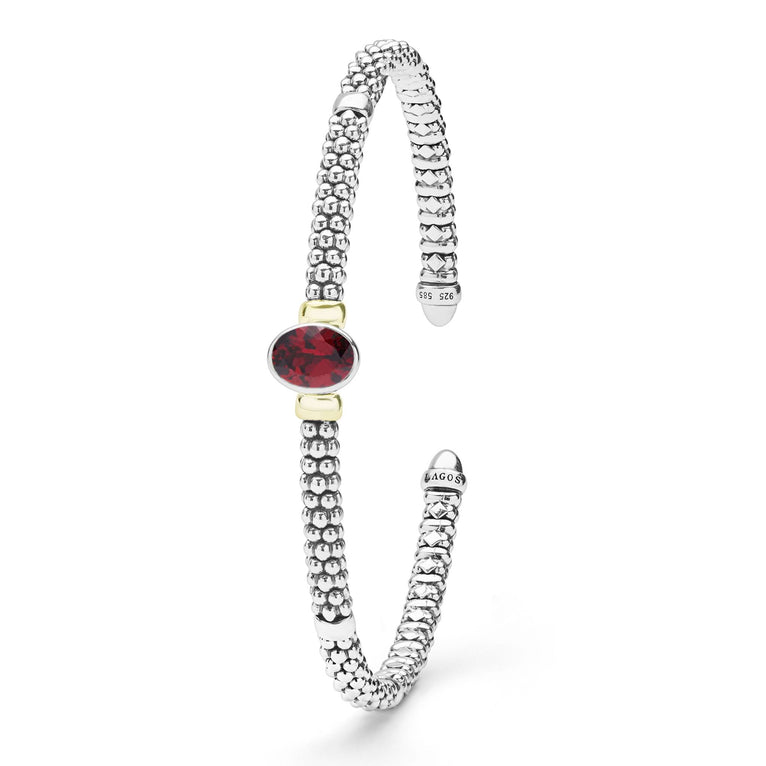  3mm features sterling silver caviar beading, 14K gold accents, and a striking oval garnet gemstone.