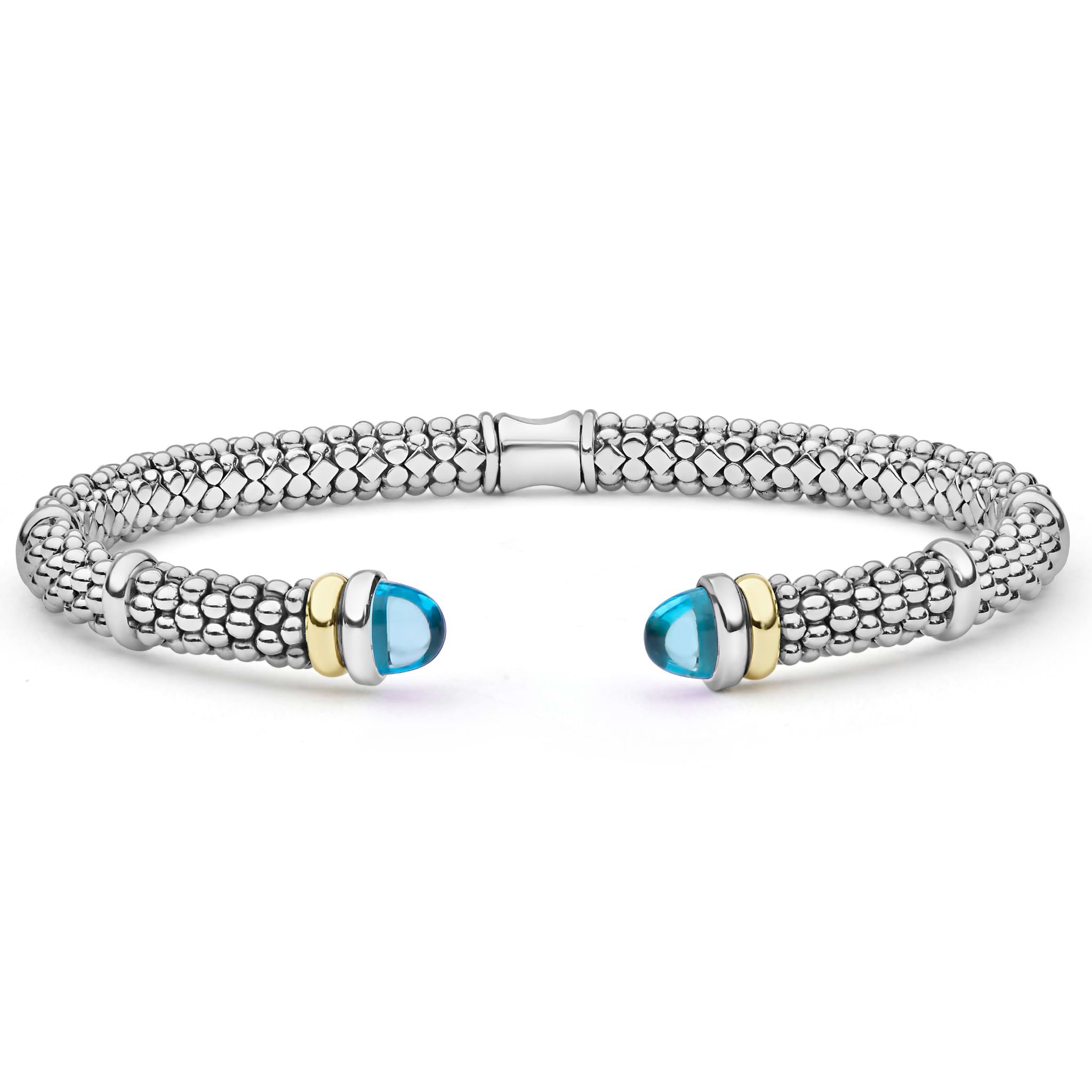 Signature Caviar Two-Tone Swiss Blue Topaz Versa Torque Bracelet in sterling silver with caviar beading and 14K gold accents, featuring blue topaz cabochon end caps.
