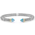 Signature Caviar Two-Tone Swiss Blue Topaz Versa Torque Bracelet in sterling silver with caviar beading and 14K gold accents, featuring blue topaz cabochon end caps.