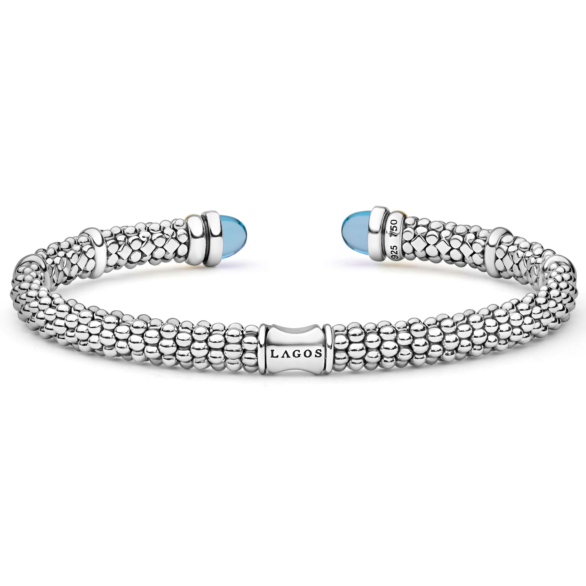 Signature Caviar Two-Tone Swiss Blue Topaz Versa Torque Bracelet in sterling silver with 14K gold accents, featuring caviar beading and vivid sky-blue cabochon end caps.