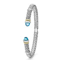 Signature Caviar Two-Tone Swiss Blue Topaz Versa Torque Bracelet in sterling silver, showcasing caviar beading and 14K gold accents with blue topaz cabochon ends.