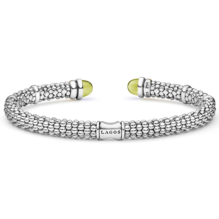 Signature Caviar Two-Tone Green Quartz Versa Torque Bracelet in sterling silver, featuring dual beaded cuffs, cabochon-cut green quartz end caps, and elegant 14K gold accents.