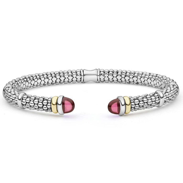  5mm: A sterling silver cuff with 14K gold accents and garnet cabochons, showcasing refined craftsmanship and bold elegance.