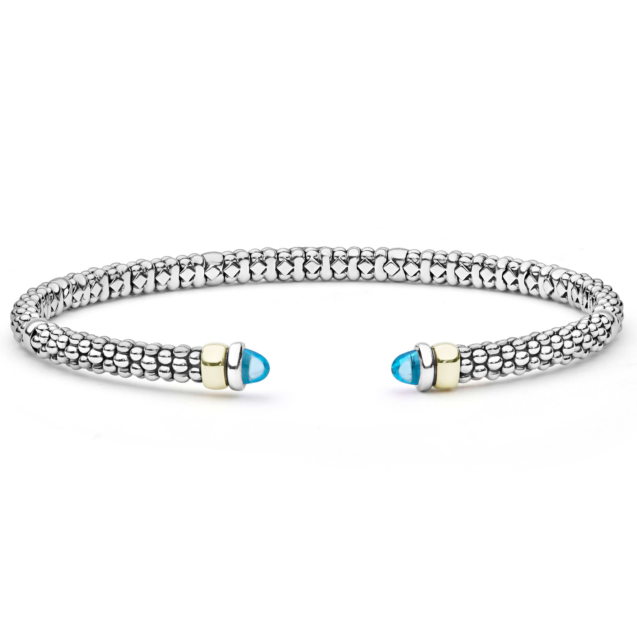  3mm: A sterling silver cuff with caviar beading, 14K gold accents, and blue topaz cabochons.