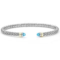  3mm: A sterling silver cuff with caviar beading, 14K gold accents, and blue topaz cabochons.