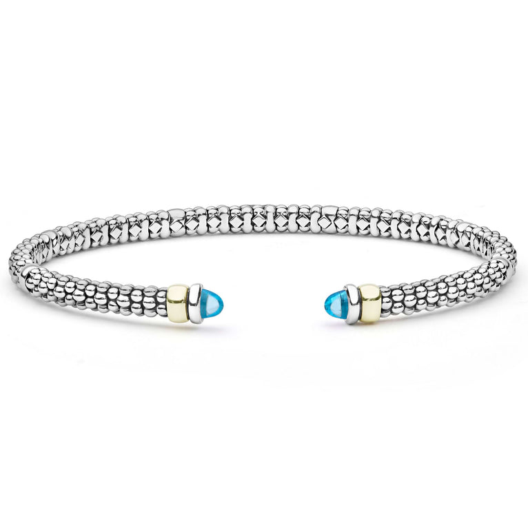  3mm: A sterling silver cuff with caviar beading, 14K gold accents, and blue topaz cabochons.