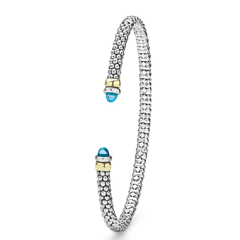 Signature Caviar Two-Tone Swiss Blue Topaz Mini Versa Torque Bracelet in sterling silver with caviar beading, 14K gold accents, and blue topaz gemstone caps, showcasing modern elegance.