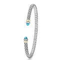 Signature Caviar Two-Tone Swiss Blue Topaz Mini Versa Torque Bracelet in sterling silver with 14K gold accents, featuring caviar beading and Swiss blue topaz end caps.