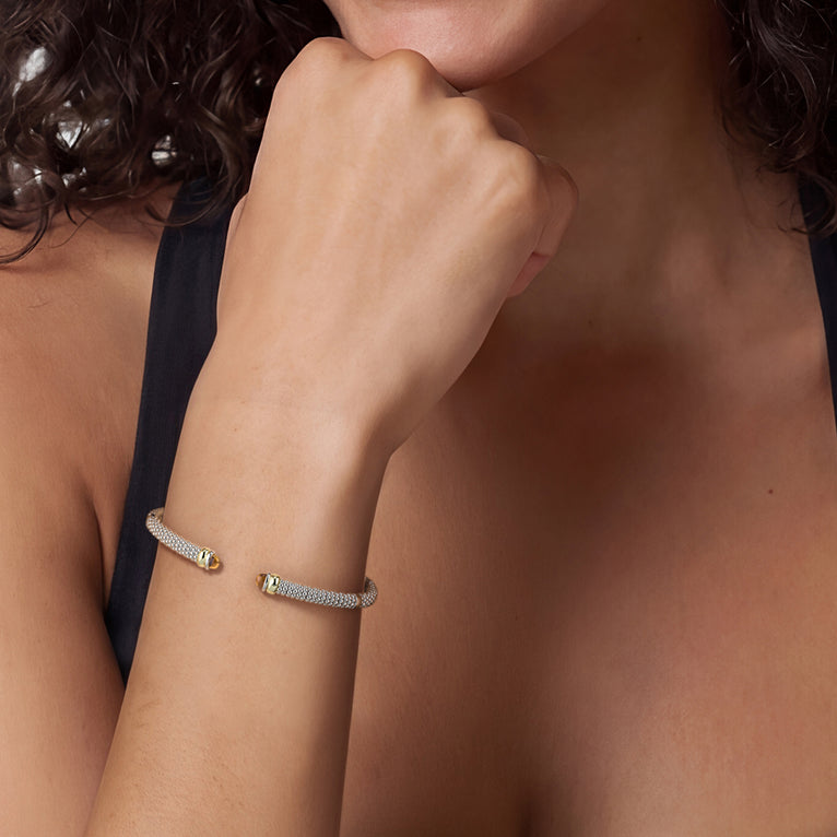 Woman wearing the Two-Tone Citrine Mini Versa Torque Bracelet