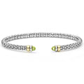 Signature Caviar Two-Tone Peridot Mini Versa Torque Bracelet in sterling silver with caviar beading, 14K gold accents, and peridot gemstone end caps.