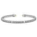 Signature Caviar Two-Tone Peridot Mini Versa Torque Bracelet in sterling silver with caviar beading, 14K gold accents, and green peridot cabochon end caps.