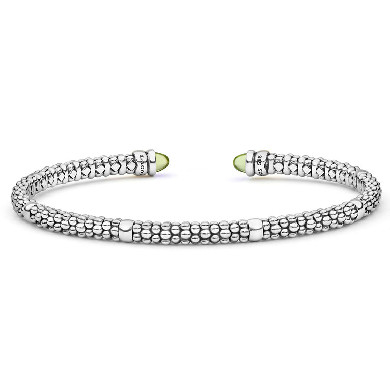 Signature Caviar Two-Tone Peridot Mini Versa Torque Bracelet in sterling silver with caviar beading, 14K gold accents, and green peridot cabochon end caps.