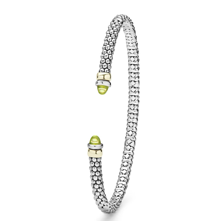 Signature Caviar Two-Tone Peridot Mini Versa Torque Bracelet in sterling silver with 14K gold accents, featuring caviar beading and vivid green peridot gemstone end caps.