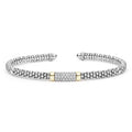 A silver cuff bracelet with a textured beaded outer band, a central pavé diamond-set rectangular section, and two small gold accent bands.