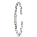 Signature Caviar Two-Tone Medium Diamond Station Mini Versa Torque Bracelet in sterling silver, featuring 14K gold accents and pavé-set diamonds with Caviar beading, showcasing LAGOS craftsmanship.