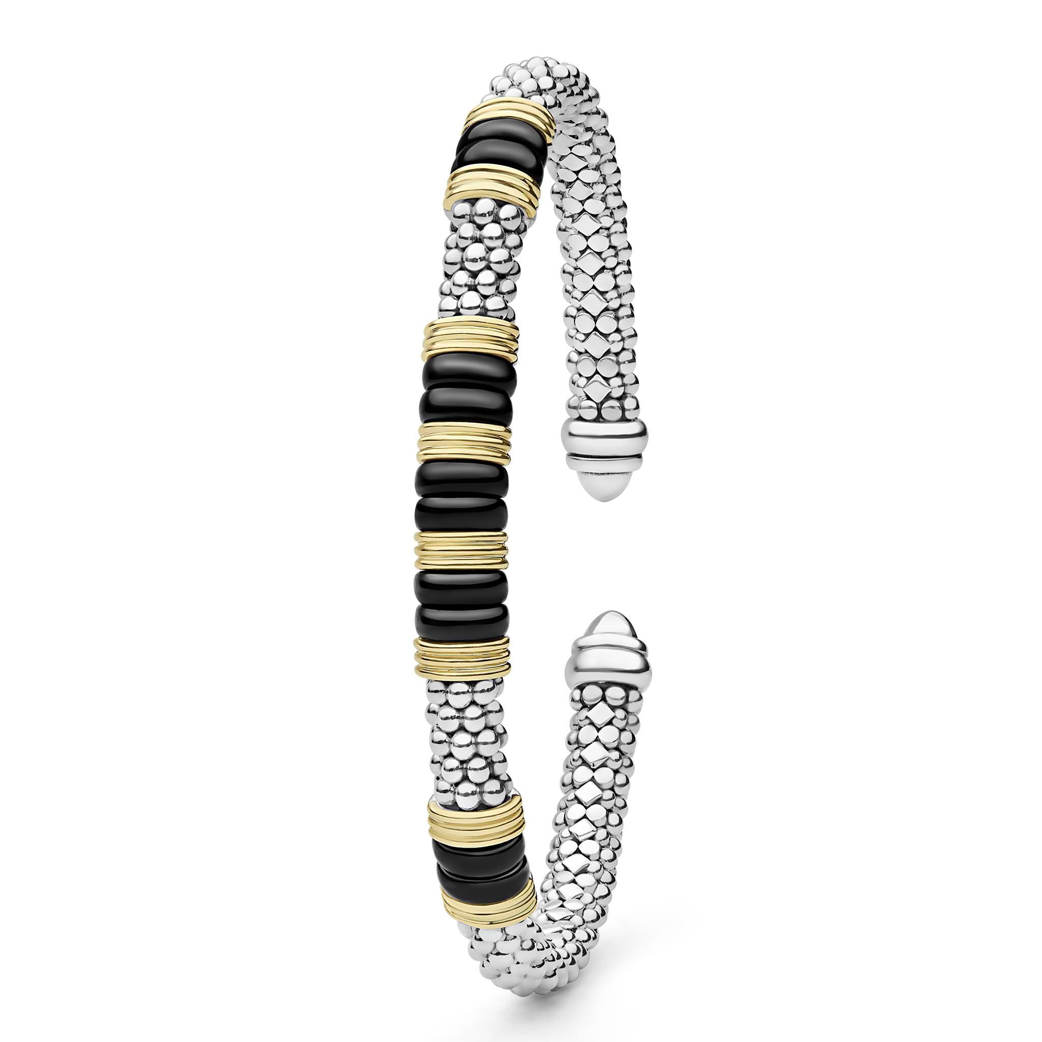Black Caviar Two-Tone Five Station Black Ceramic Versa Torque Bracelet featuring sterling silver caviar beading and 18K gold accents, elegantly coiled with black ceramic sections.