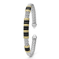Black Caviar Two-Tone Five Station Black Ceramic Versa Torque Bracelet featuring sterling silver caviar beading and 18K gold accents, elegantly coiled with black ceramic sections.