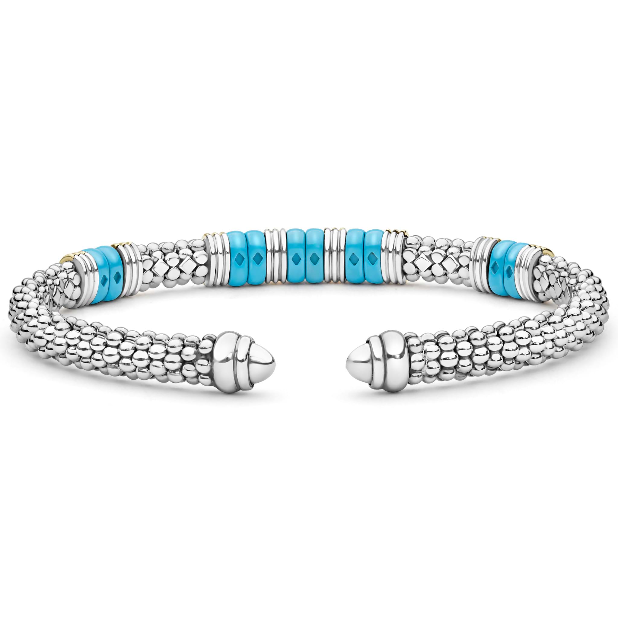 Blue Caviar Two-Tone Five Station Blue Ceramic Versa Torque Bracelet features sterling silver caviar beading, 18K gold accents, and vibrant blue ceramic stations, showcasing elegance and craftsmanship.