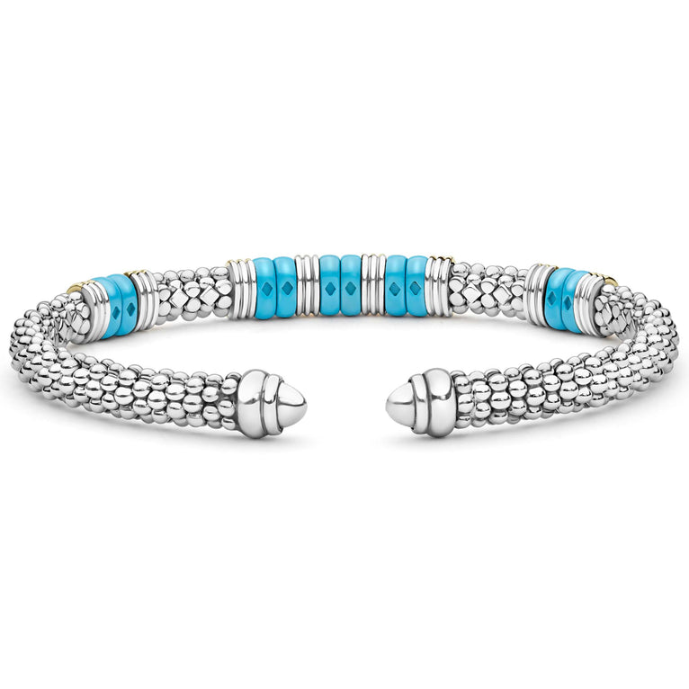 Blue Caviar Two-Tone Five Station Blue Ceramic Versa Torque Bracelet features sterling silver caviar beading, 18K gold accents, and vibrant blue ceramic stations, showcasing elegance and craftsmanship.