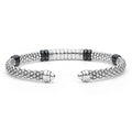 Black Caviar Two-Tone Diamond Station Black Ceramic Versa Torque Bracelet featuring sterling silver caviar beading, 18K gold accents, and a central diamond station with black ceramic highlights.