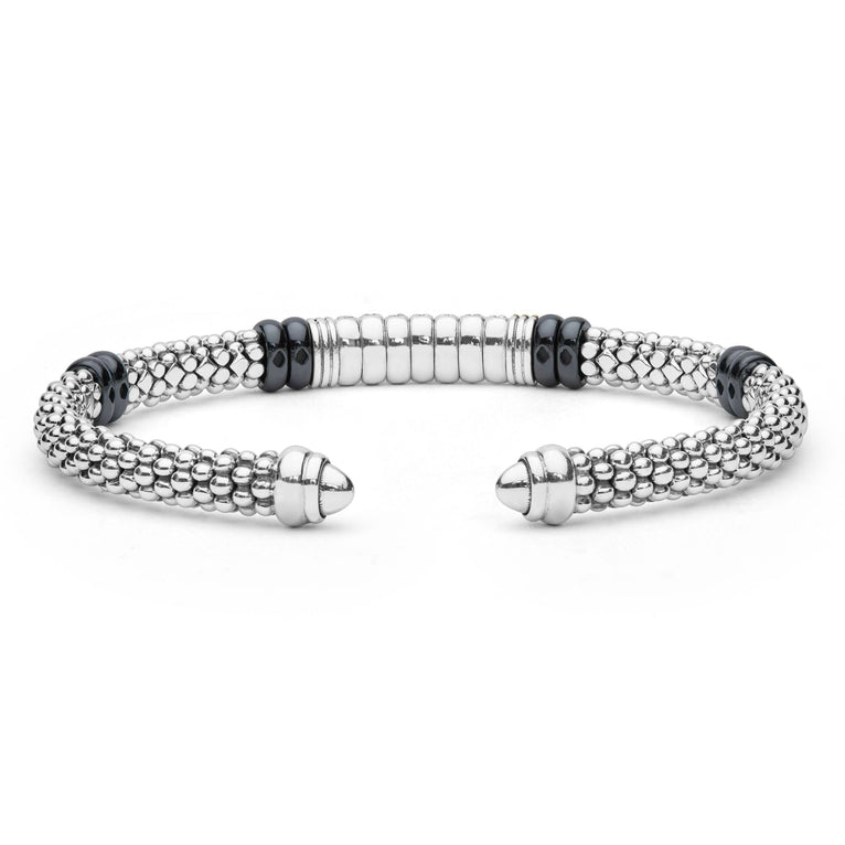 Black Caviar Two-Tone Diamond Station Black Ceramic Versa Torque Bracelet featuring sterling silver caviar beading, 18K gold accents, and a central diamond station with black ceramic highlights.