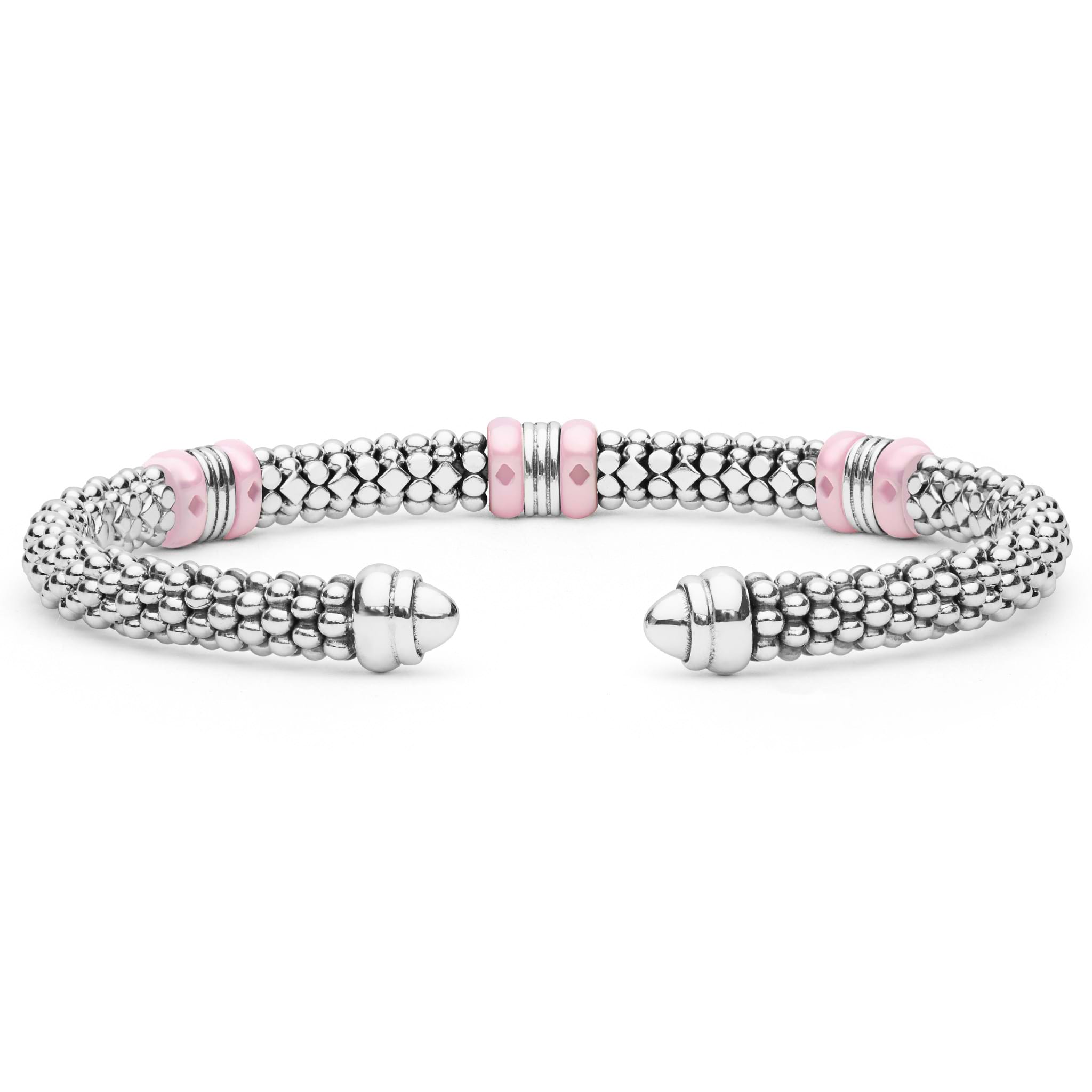 Pink Caviar Two-Tone Three Station Pink Ceramic Versa Torque Bracelet features polished sterling silver beading, 18K gold stations, and pink ceramic accents, showcasing open cuff elegance.