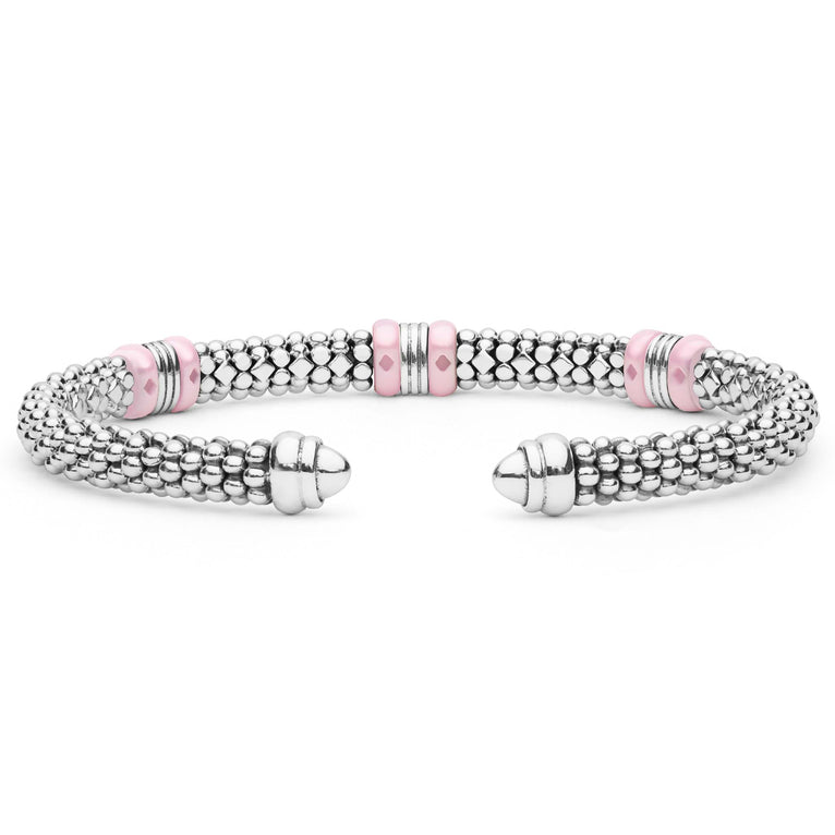 Pink Caviar Two-Tone Three Station Pink Ceramic Versa Torque Bracelet features polished sterling silver beading, 18K gold stations, and pink ceramic accents, showcasing open cuff elegance.