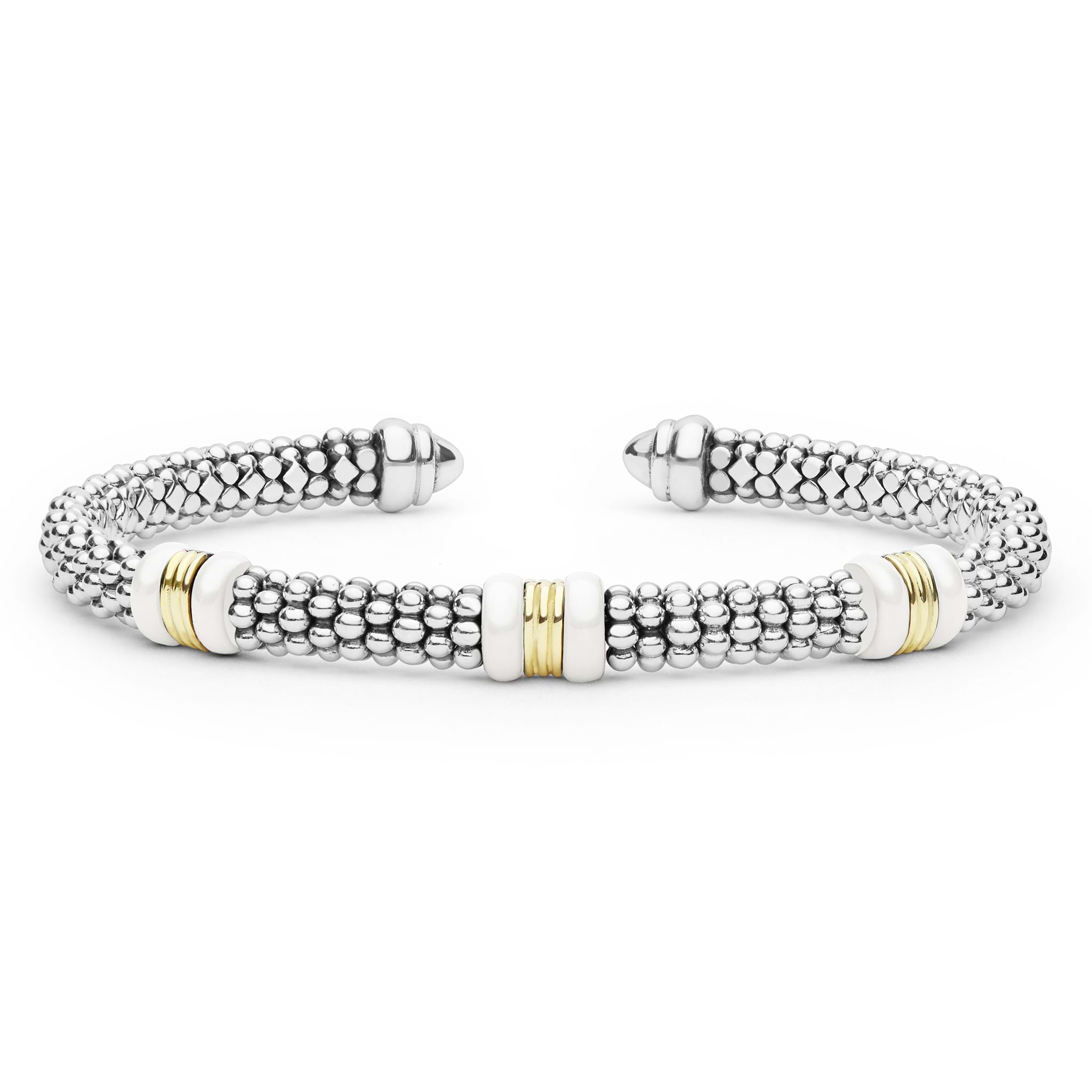 White Caviar Two-Tone Three Station White Ceramic Versa Torque Bracelet features sterling silver caviar beading, 18K gold stations, and white ceramic accents for a refined, sophisticated look.