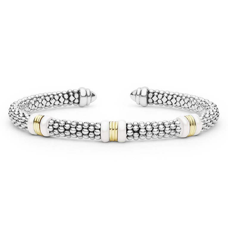 White Caviar Two-Tone Three Station White Ceramic Versa Torque Bracelet features sterling silver caviar beading, 18K gold stations, and white ceramic accents for a refined, sophisticated look.
