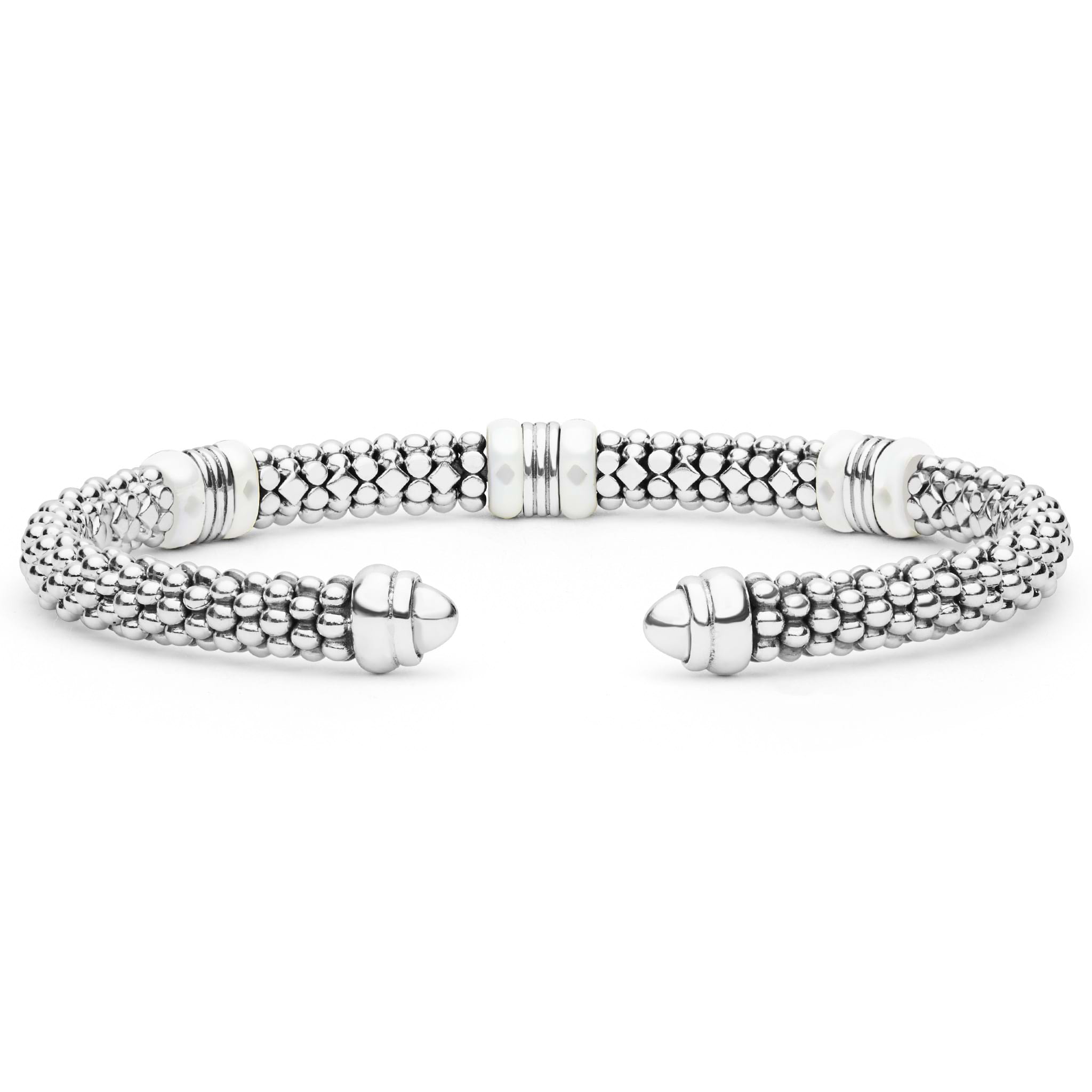White Caviar Two-Tone Three Station White Ceramic Versa Torque Bracelet features sterling silver caviar beading, 18K gold stations, and white ceramic accents in a flexible cuff design.