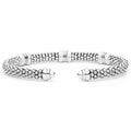 White Caviar Two-Tone Three Station White Ceramic Versa Torque Bracelet features sterling silver caviar beading, 18K gold stations, and white ceramic accents in a flexible cuff design.
