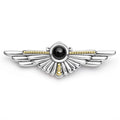 Onyx gemstone and sterling silver accented by 18K gold Caviar beading forms this wing statement pin.