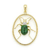 Jade with diamond and smooth 18K gold form this beetle pendant.