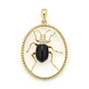 Onyx with diamond and smooth 18K gold form this beetle pendant.