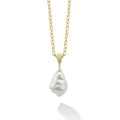 A timeless cultured freshwater baroque pearl pendant finished on an 18K Gold link necklace.