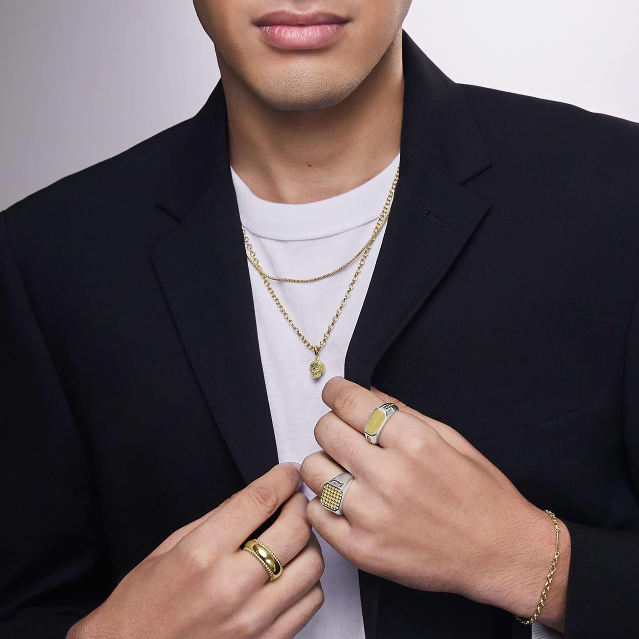 Man wearing 18k gold caviar jewelry